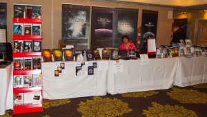 Penny Grubb manages the book stall before the crowds descend. 